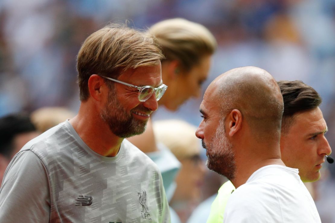 Liverpool manager Jurgen Klopp (L) greets Manchester City's Pep Guardiola (R) before kick off of the English FA Community Shield in August.