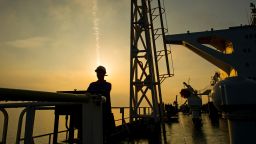 A crew man stands on the deck of the crude oil tanker 'Devon' as it sails through the Persian Gulf towards Kharq Island oil terminal to transport crude oil to export markets in the Persian Gulf, Iran, on Friday, March 23, 2018. Geopolitical risk is creeping back into the crude oil market. Photographer: Ali Mohammadi/Bloomberg via Getty Images