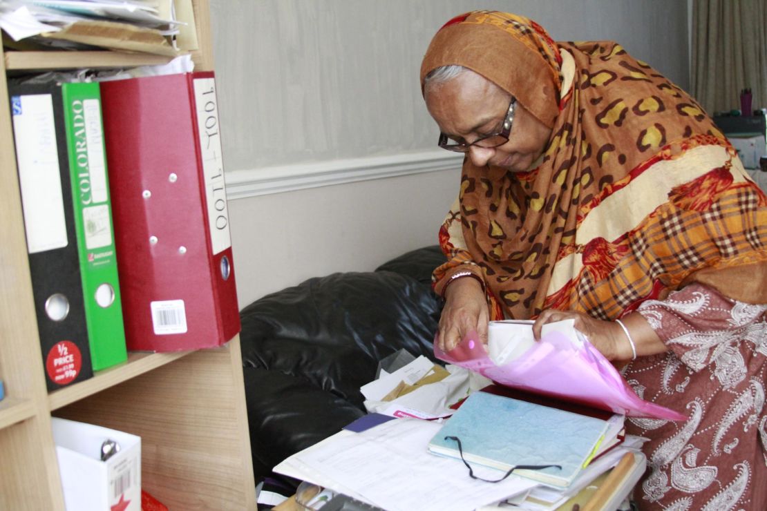 Patel is going through her heathcare paperwork. Her welfare payments have been cut in recent years.