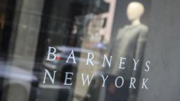 Signage for Barneys New York department store is displayed on the store's window, Tuesday July 16, 2019, in New York. The luxury retailer could be joining a growing list of retailers that have filed for bankruptcy. (AP Photo/Bebeto Matthews)