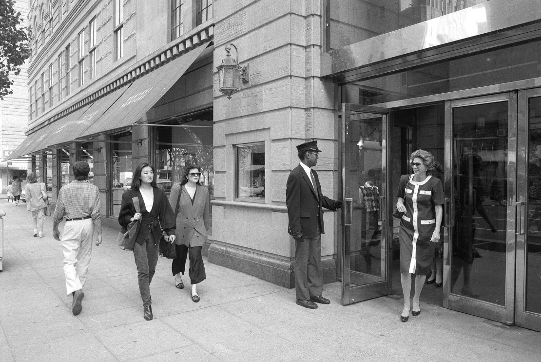 Pedestrians walk past the Barneys store at 7th Avenue and 17th Street in New York, on May 22, 1989.