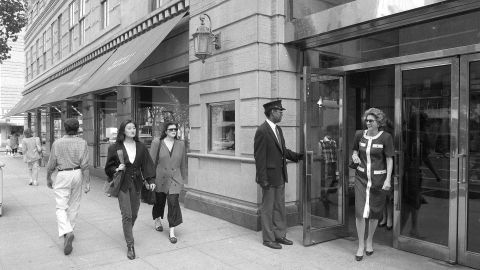 Pedestrians walk past the Barneys store at 7th Avenue and 17th Street in New York, on May 22, 1989.