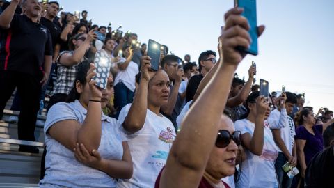 Community members attend a vigil for a high school student gunned down in this month's El Paso shooting.