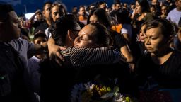 Dina Rodriguez, right, is comforted after attending a vigil for her son, Javier Rodriguez, 15, a sophomore at Horizon High School in Horizon, Texas, Monday, Aug. 5, 2019. Rodriguez was among the 22 killed in the shooting at a Walmart on Aug. 3 in El Paso.