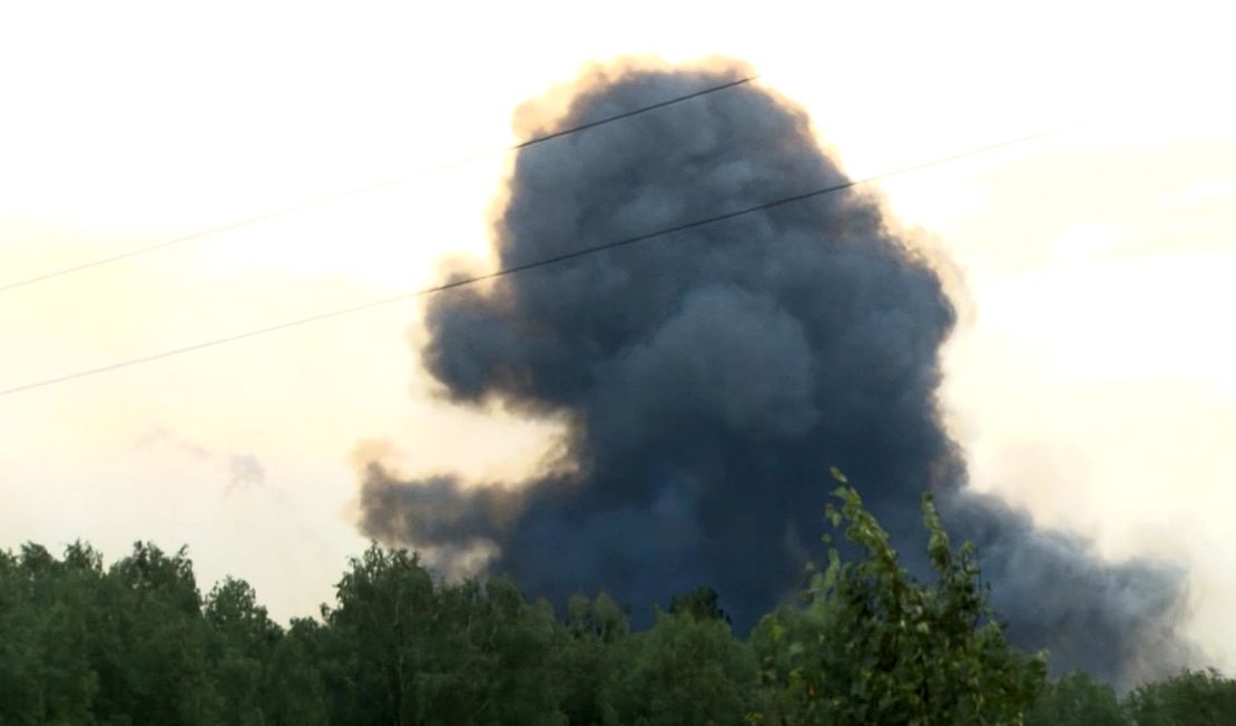 Smoke rises after explosions at a military base near Achinsk, Siberia on Monday, Aug. 5, 2019.