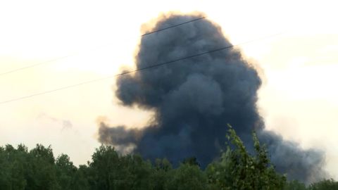 Smoke rises after explosions at a military base near Achinsk, Siberia on Monday, Aug. 5, 2019.