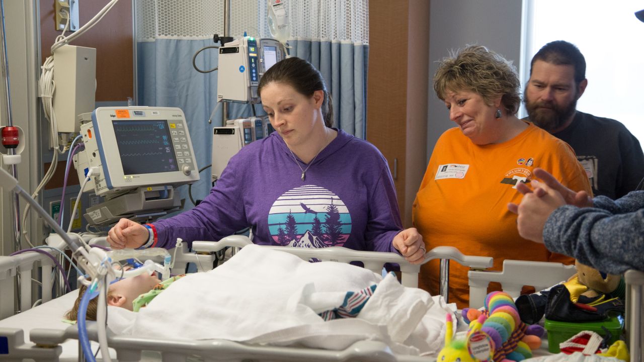 Brooke Kilburn, far left, watches over her son, Cooper, in the hospital.