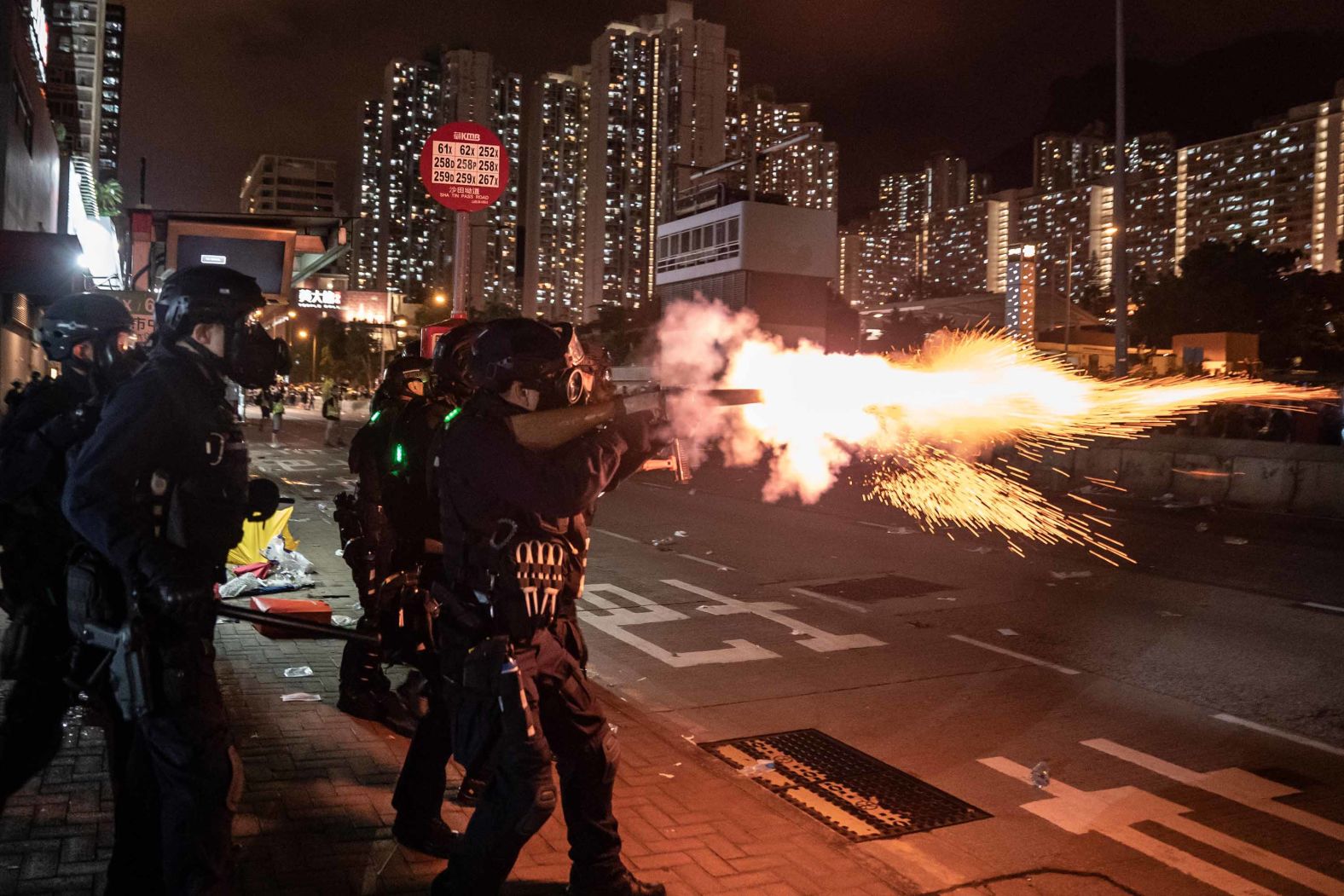 Police fire tear gas at protesters during a demonstration in the Wong Tai Sin District on Monday, August 5.