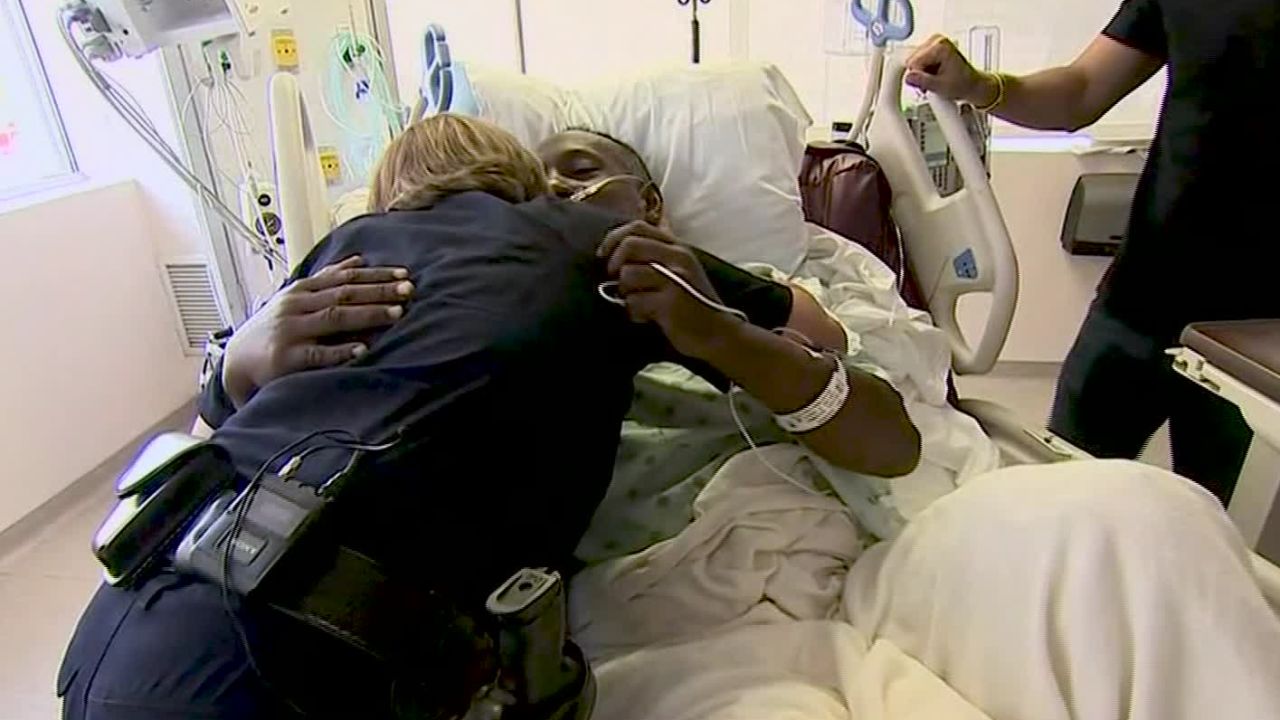 Sifford and Grant embrace two days after the mass shooting. 