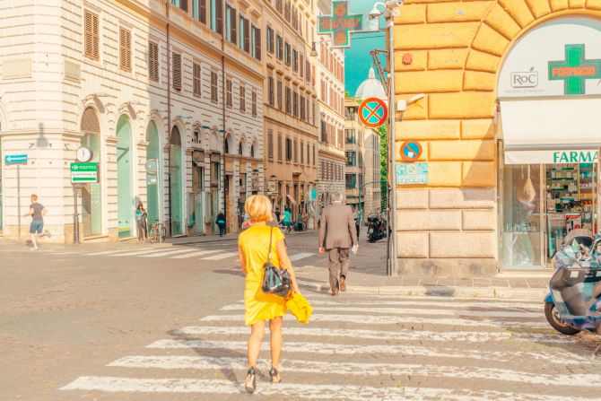 "This is just a magical moment, after a storm came through in Florence. You can actually see that off in the distance. There was this amazing golden light coming through and just the perfect kind of scenario, lighting this fantastic canary yellow dress walking across the road."