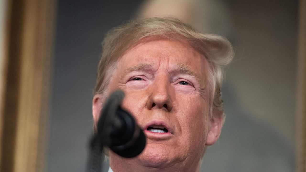 US President Donald Trump speaks about the mass shootings from the Diplomatic Reception Room of the White House in Washington, DC, August 5, 2019. - US President Donald Trump described mass shootings in Texas and Ohio as a "crime against all of humanity" as he addressed the nation on Monday after the attacks that left in 29 people dead. "These barbaric slaughters are... an attack upon a nation, and a crime against all of humanity," he said. (Photo by SAUL LOEB / AFP)        (Photo credit should read SAUL LOEB/AFP/Getty Images)