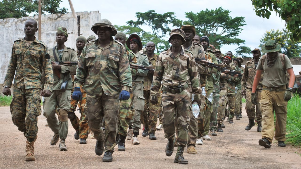 Central African Army (FACA) troops march alongside their Russian trainers at Berengo, once the palace of former CAR President Jean-Bédel Bokassa. More recently these recruits have been fighting to repel rebel attacks across the country.