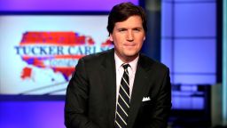 FILE - In this March 2, 2017, file photo, Tucker Carlson, host of "Tucker Carlson Tonight," poses for photos in a Fox News Channel studio in New York. Carlson says he's shocked his segments this week on a South African policy on land reform should be considered an appeal to white nationalists - let alone spark an international incident. (AP Photo/Richard Drew, File)