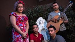 Alma Diaz, 43, left, and her children Daniel, 25, a cashier at Speaking Rock Casino, second from left, Diego, 23, a teacher at the Most Holy Trinity Catholic School, second from right, and her husband Armando Diaz, 43, a small business owner, right, pose for a portrait outside their home in Socorro, Texas, Tuesday, Aug. 6, 2019.