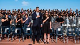 Democratic presidential candidate Beto O'Rourke, left, and his wife Amy O'Rourke, right, attend a ceremony honoring the victims of the Aug. 3 mass shooting, at El Dorado High School in El Paso, Texas, Wednesday, Aug. 7, 2019.