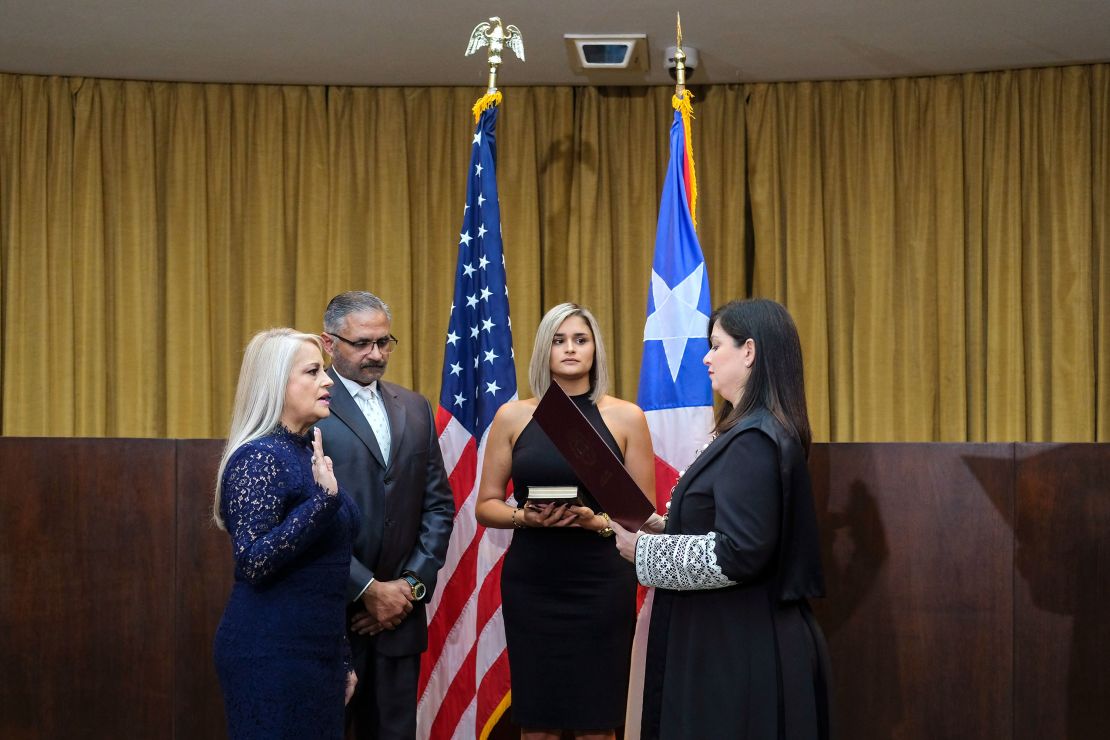 Justice Secretary Wanda Vazquez is sworn in as governor of Puerto Rico by Supreme Court Justice Maite Oronoz in San Juan on Wednesday. 