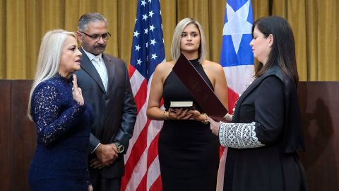 Justice Secretary Wanda Vazquez is sworn in as governor of Puerto Rico by Supreme Court Justice Maite Oronoz in San Juan on Wednesday.