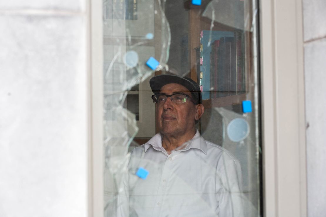 A caretaker at the Galway Maryam Mosque surveys damage from the July attack. 