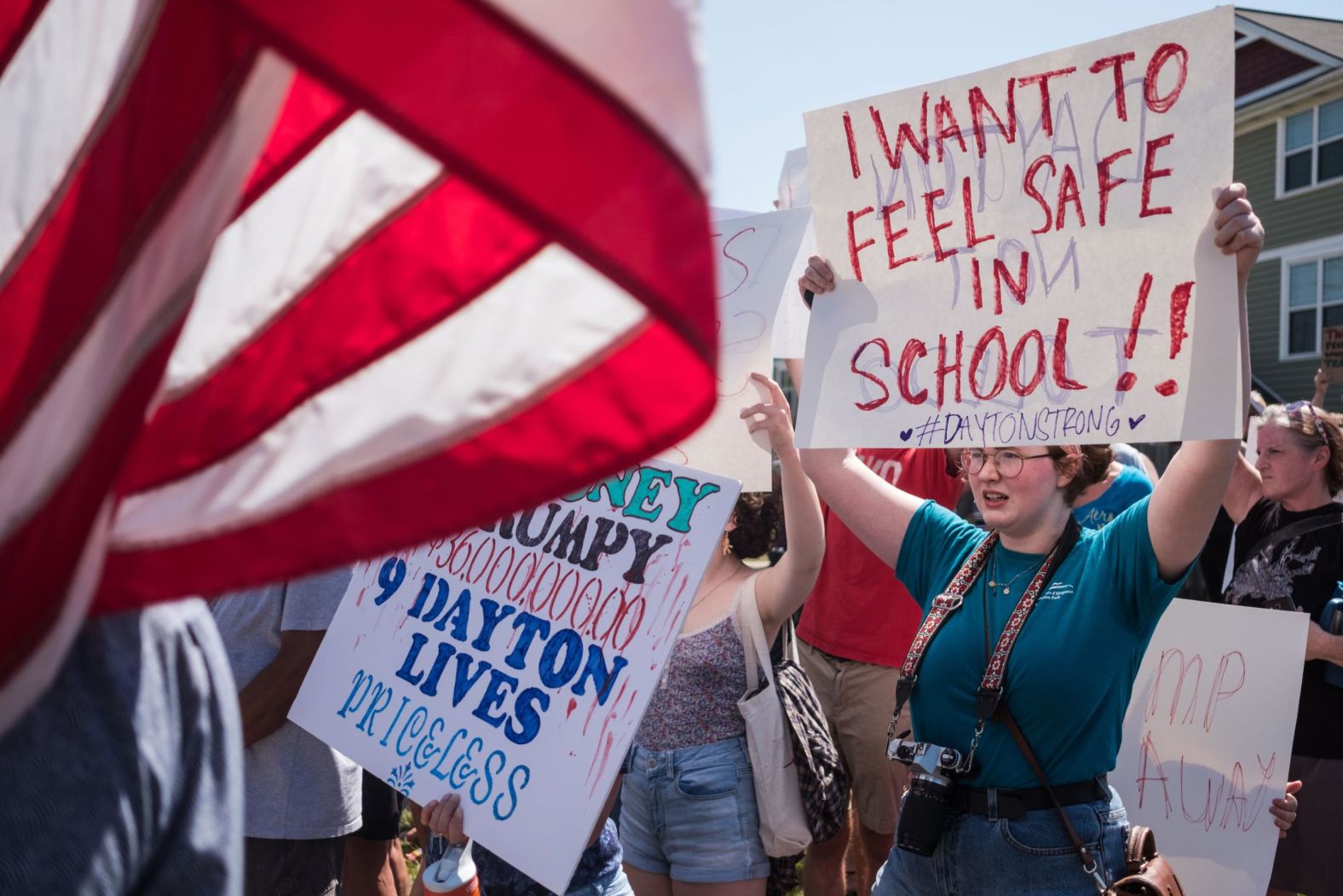 Demonstrators in Dayton, Ohio, protest the visit of President Donald Trump on August 7. Trump visited both Dayton and El Paso on Wednesday.