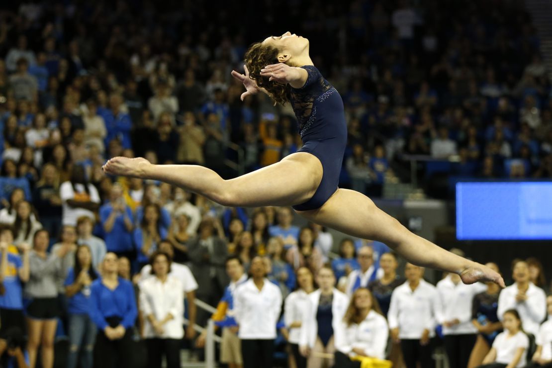 Ohashi competes in floor exercise during a meet at Pauley Pavilion in Los Angeles, California.