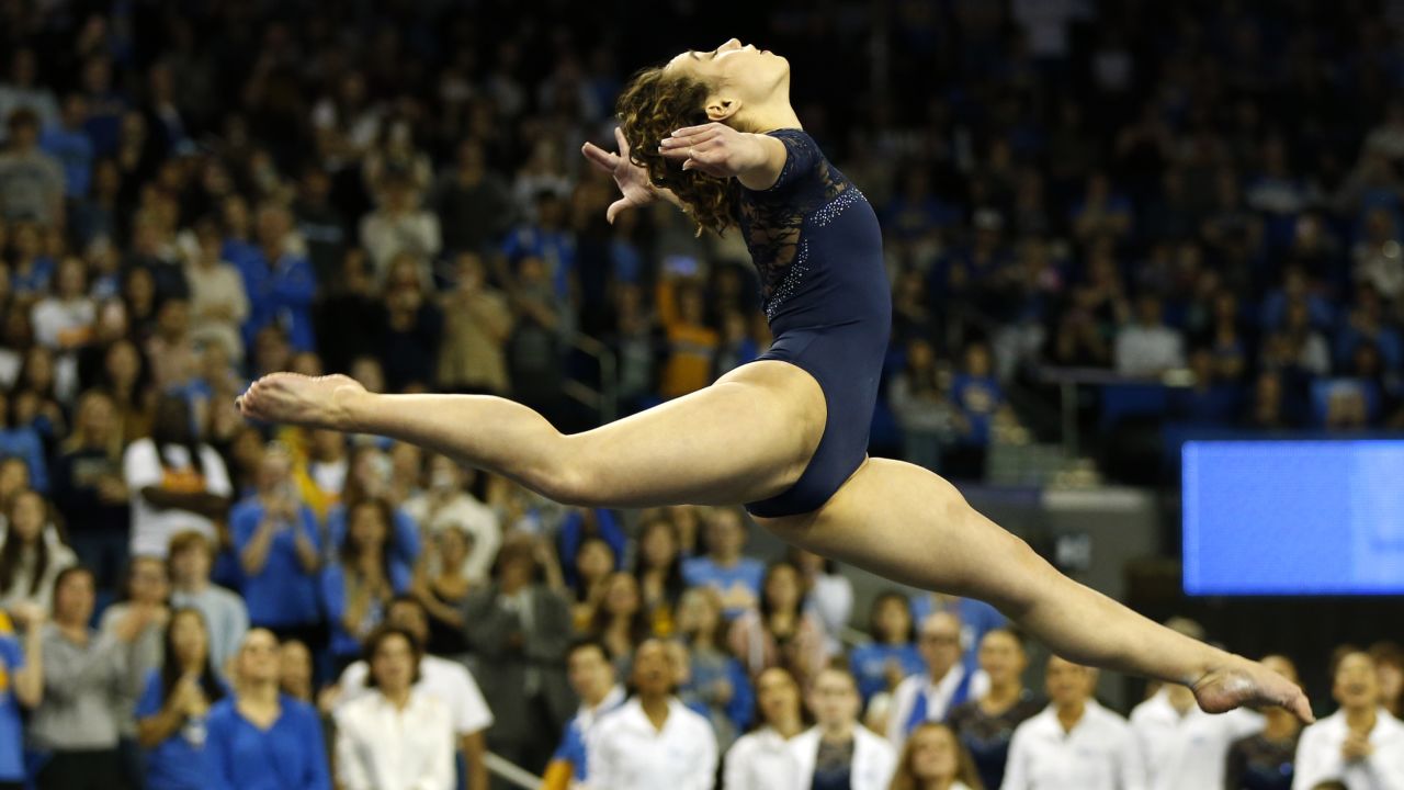 Ohashi competes in floor exercise during a meet at Pauley Pavilion in Los Angeles, California.