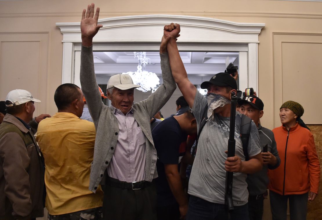 Supporters of former Kyrgyz president Almazbek Atambayev reportedly guard his house in the village of Koi-Tash on August 7.