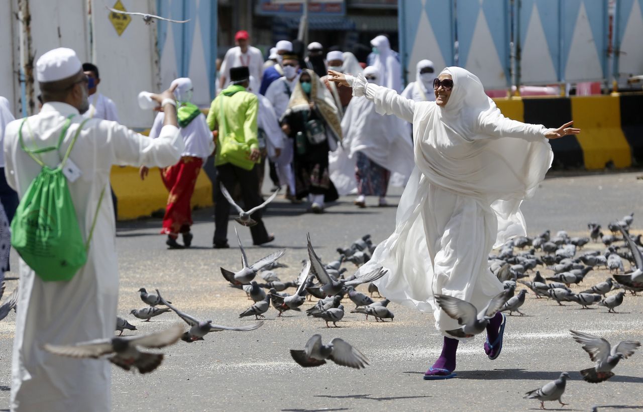 A pilgrim runs outside the Grand Mosque on Sunday, August 4.