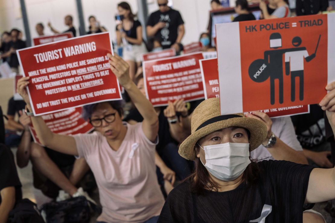 Protesters rally against a controversial extradition bill in the arrivals hall of the international airport on July 26, 2019, in Hong Kong, China. 
