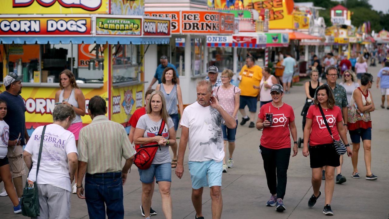 DES MOINES, IOWA - AUGUST 08: Fair-goers walk past the food venders lining Grand Avenue at the Iowa State Fair August 08, 2019 in Des Moines, Iowa. 22 of the 23 politicians seeking the Democratic Party presidential nomination will be visiting the fair this week, six months ahead of the all-important Iowa caucuses. (Photo by Chip Somodevilla/Getty Images)