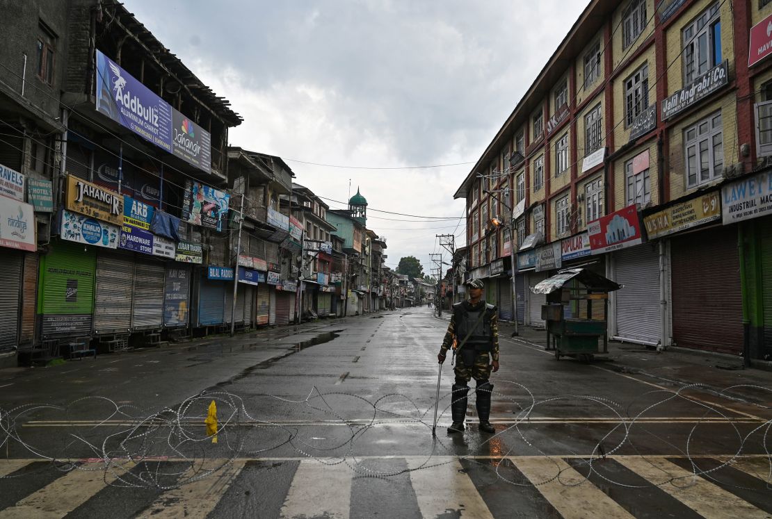 An Indian security  guard in Srinagar on August 8, 2019, after widespread restrictions on movement and a telecommunications blackout were put in place.