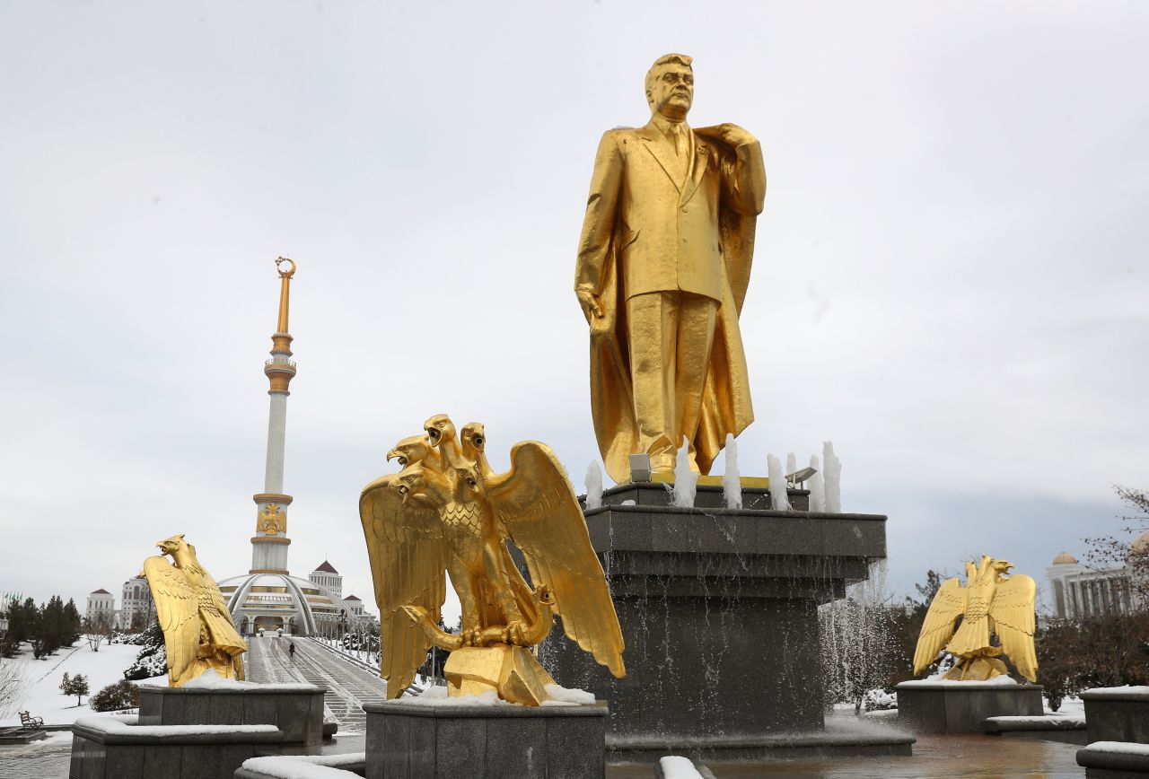 A golden staue of the first Turkmen president Saparmurat Niyazov, near the Independence Monument, in Ashgabat.  