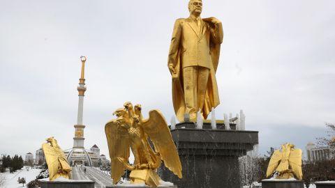 A golden staue of the first Turkmen president Saparmurat Niyazov, near the Independence Monument, in Ashgabat.  