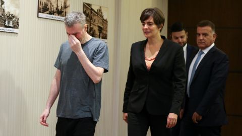 Kristian Baxter walks next to the Canadian Ambassador and Lebanon's internal security chief after being released.