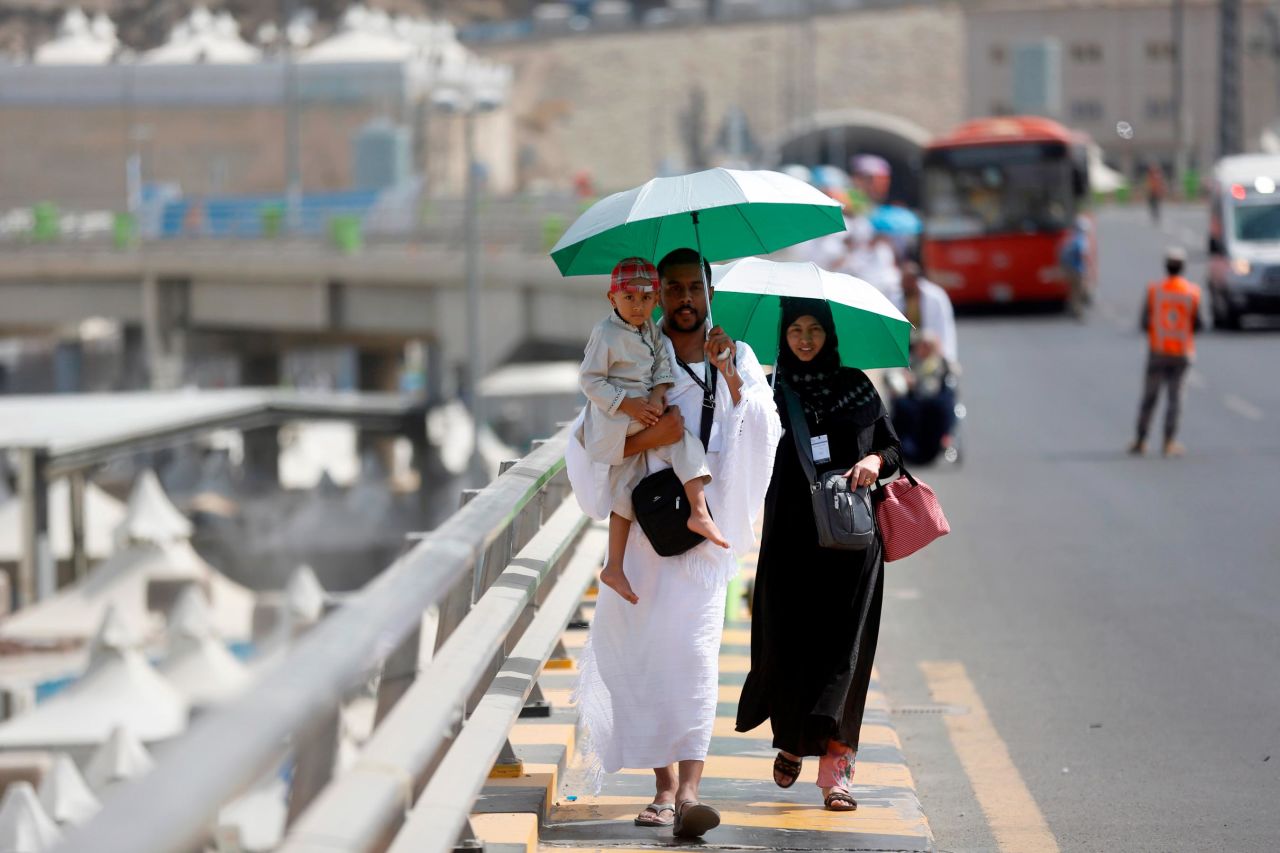 Pilgrims walk to the tent city of Mina, where they planned to spend Friday night before heading to Arafat on Saturday.
