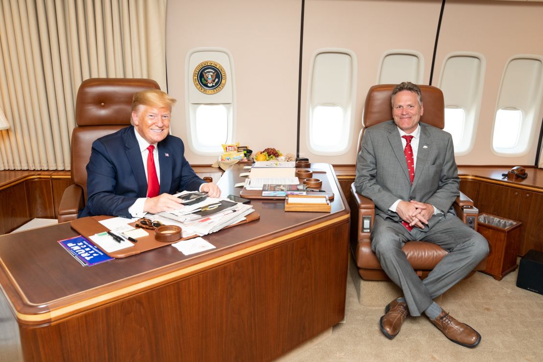 Alaska Gov. Mike Dunleavy, here with President Trump aboard Air Force One, was used as a go-between with the White House, the mine executives said. 