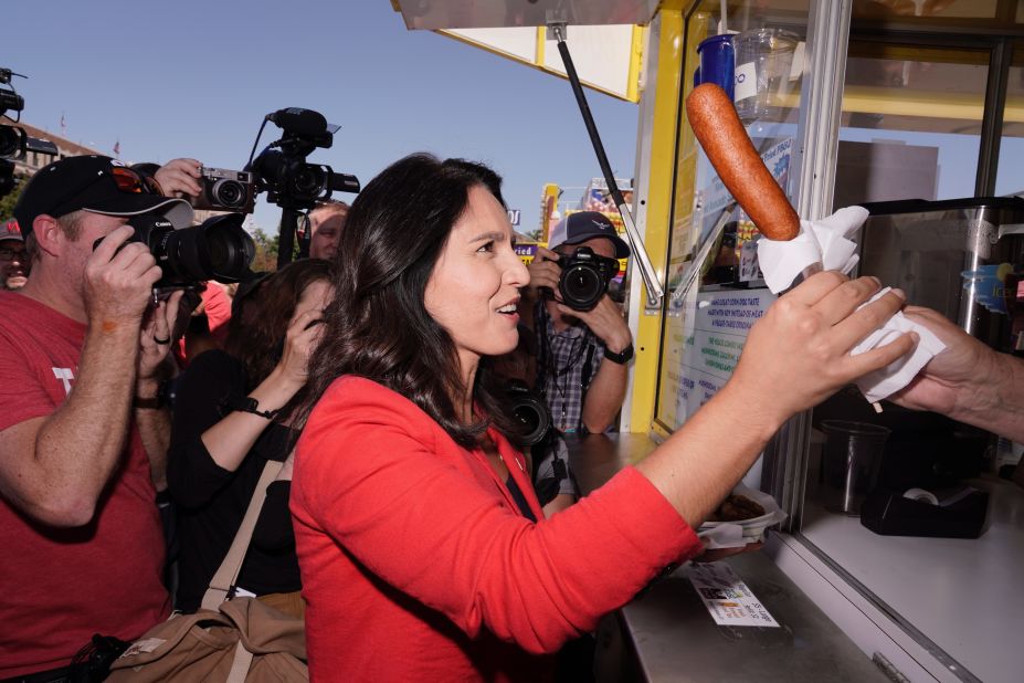 US Rep. Tulsi Gabbard, a Democratic presidential candidate, orders a veggie corn dog on Friday.