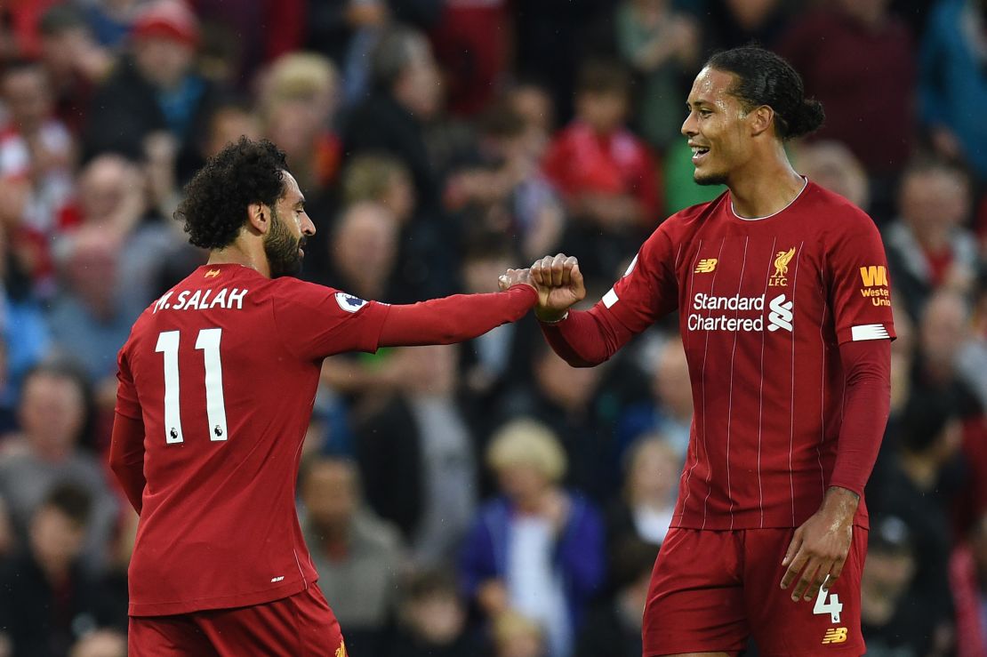 Mohamed Salah (L) celebrates with Liverpool's Dutch defender Virgil van Dijk after scoring in he 4-1 win over Norwich.