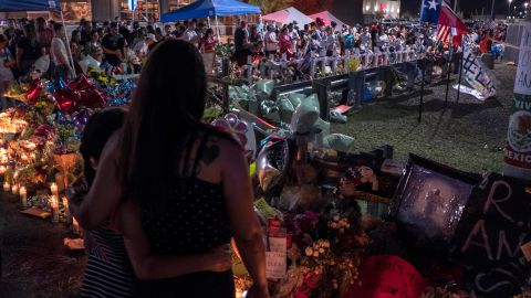 Amber Basurto, 9, left, and her mother, Priscilla Basurto, 39, visit a memorial for the El Paso victims on Thursday.