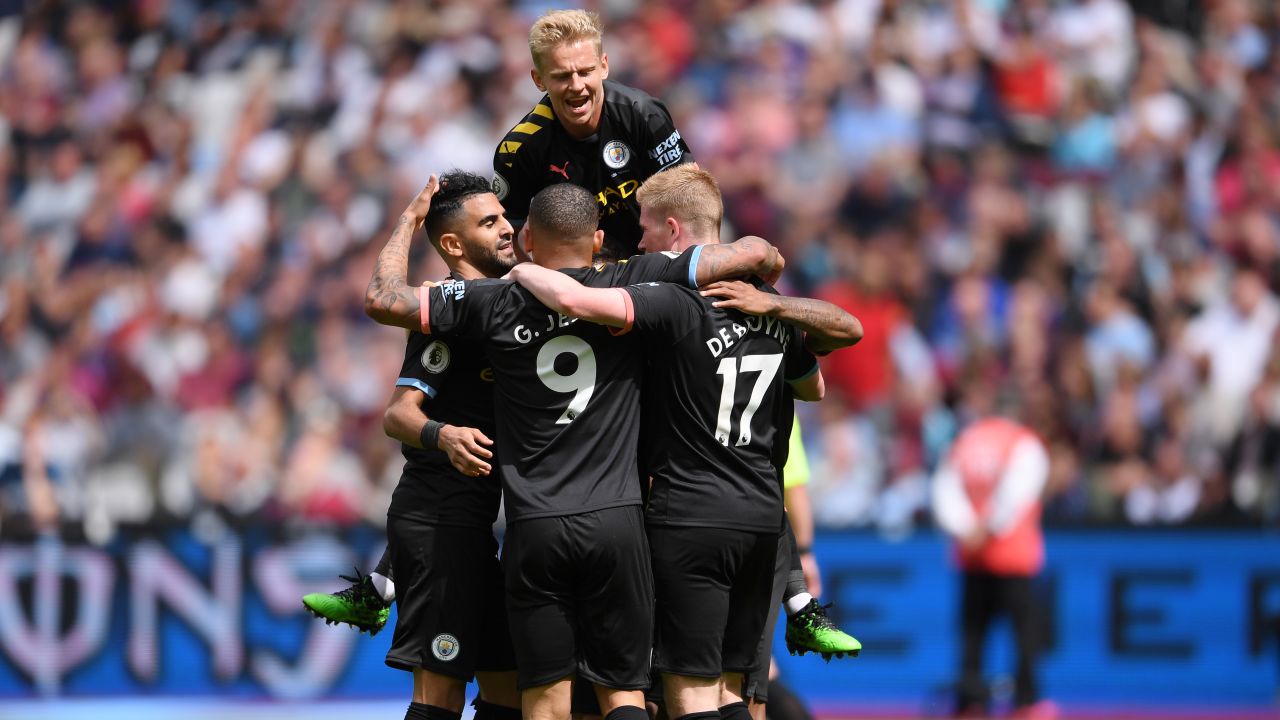 Man City players celebrate Sterling's second goals against West Ham.