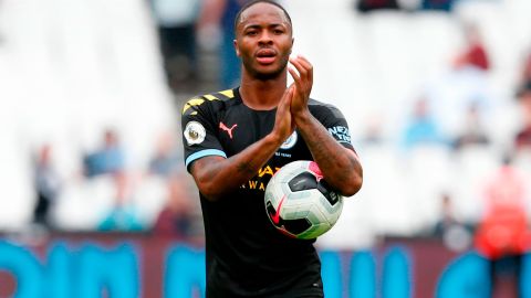 Raheem Sterling takes the match ball after scoring a hat-trick.