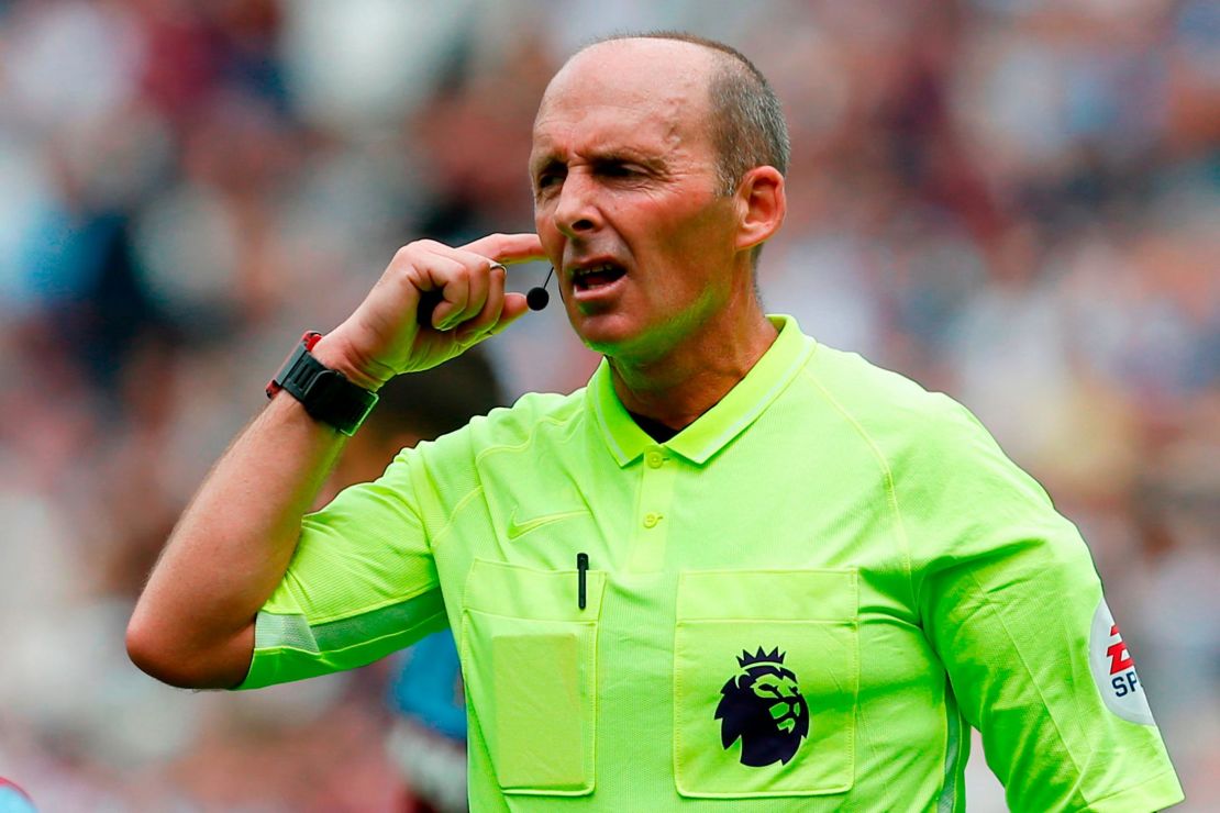 Referee Mike Dean consults the video assistant referee
