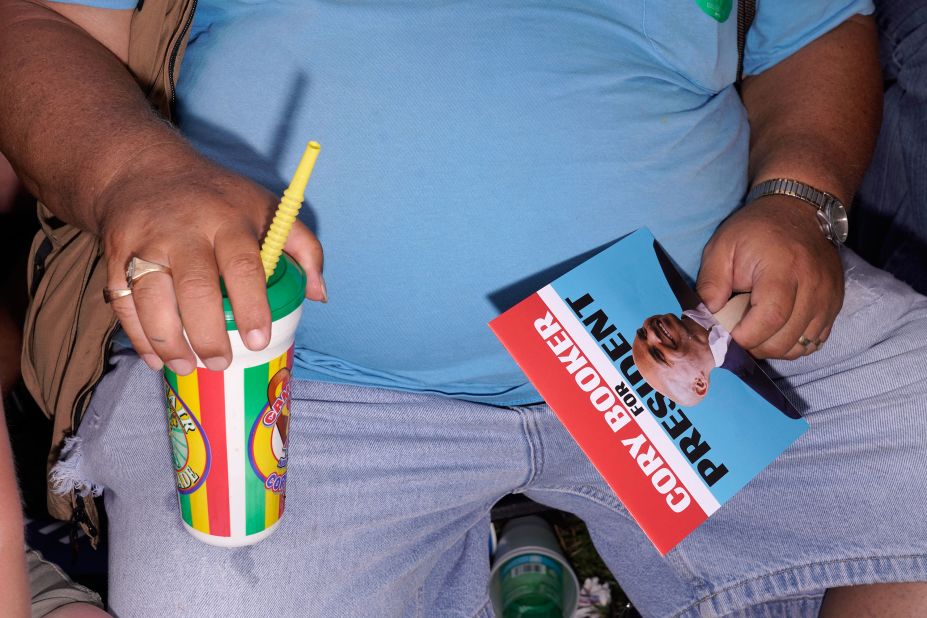 A Cory Booker supporter sits in the crowd on Saturday.