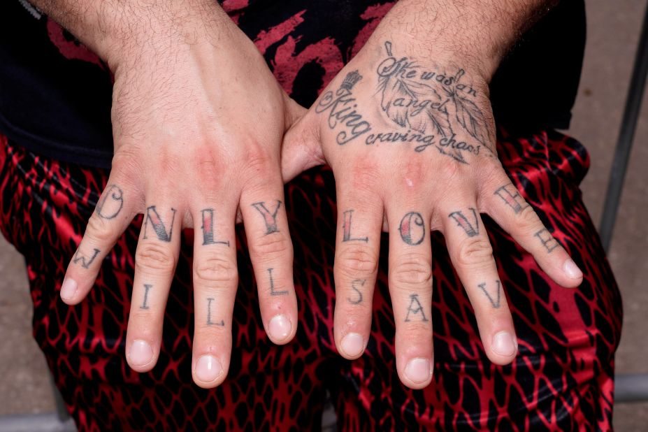 A Slipknot fan shows off his tattoos before a concert at the fair on Saturday.