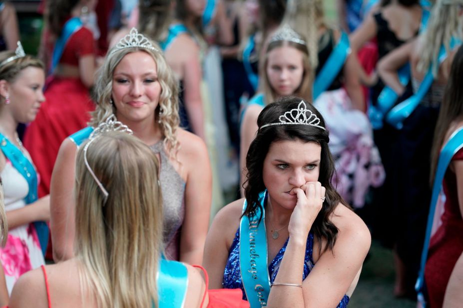 A beauty pageant contestant bites her nails.
