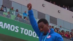 U.S. hammer thrower Gwen Berry raises her fist at the end of the national anthem at the Pan Am Games. 