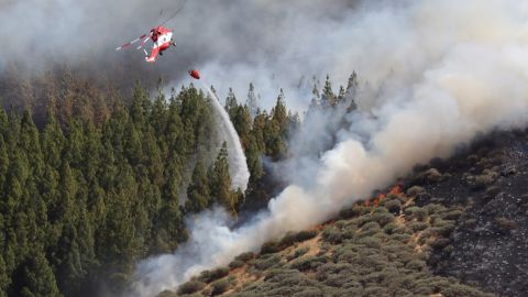 A helicopter helps fight a forest fire in Gran Canaria, Canary Islands, on August 10.