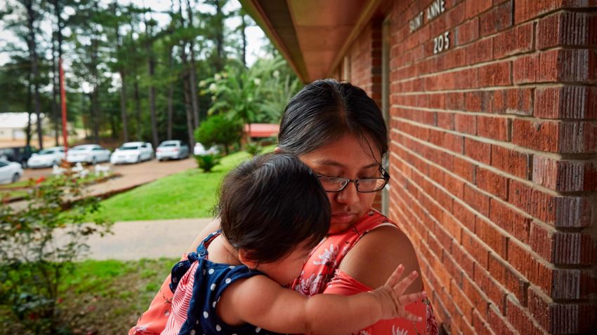 Pricila Mateo, 16, holds her daughter Chloe Mateo, 5 months, at St. Anne Catholic Church in Carthage, MS, on August 10, 2019. Mateo's mother was detained by ICE agents during raids of food processing plants in Mississippi on August 7, 2019 and released later that night after living in the United States for 19 years. Pricila is herself a United States citizen. "People need to understand what we're going through," she says.