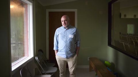 Licensed clinical social worker Tony Caldwell, 45, poses for a portrait inside a room at St. Anne Catholic Church he is using for grief counseling sessions with children affected by the ICE raids. Caldwell has concerns about how the raids will affect children. "I was with an infant this morning who was separated from her parent," he says. "That's attachment disorder happening in real time." He also worries that the raids will have consequences that feed into stereotypes if the detained workers have no source of income. "Desperate people do desperate things. It's a complete and total setup."