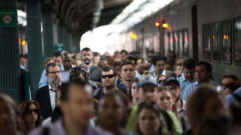 Passengers disembark from a New Jersey Transit train at the Hoboken terminal.
