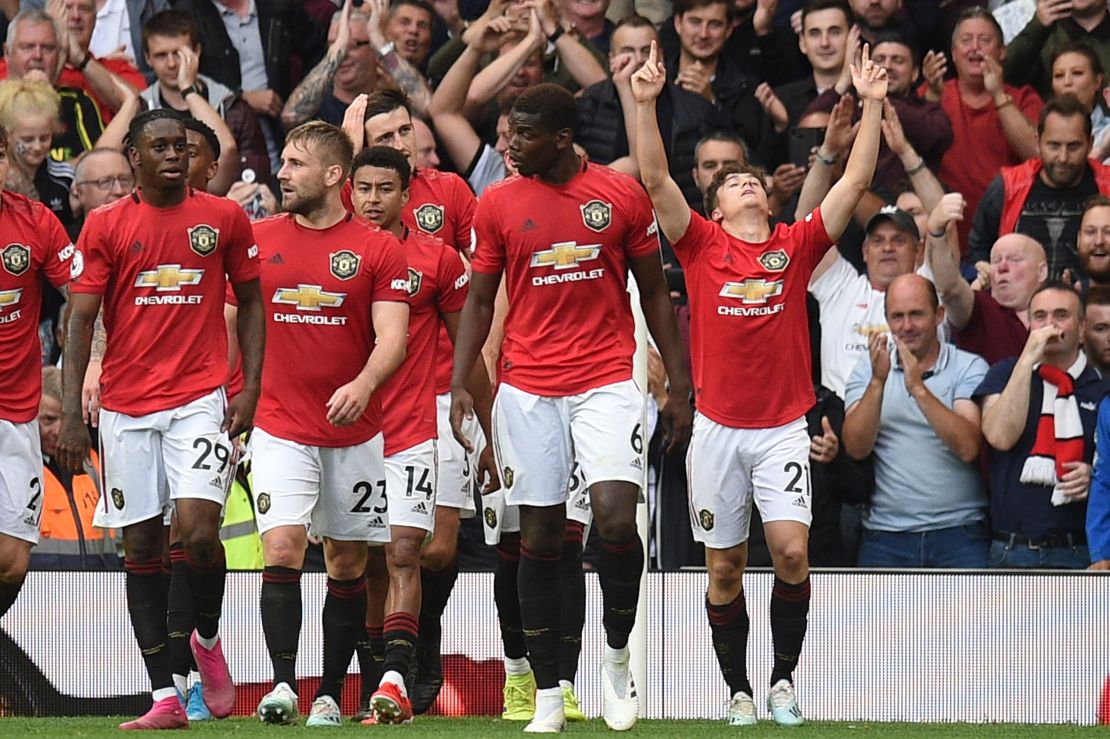 Manchester United's Daniel James (R) celebrates with teammates after scoring on his full Premier League debut against Chelsea.